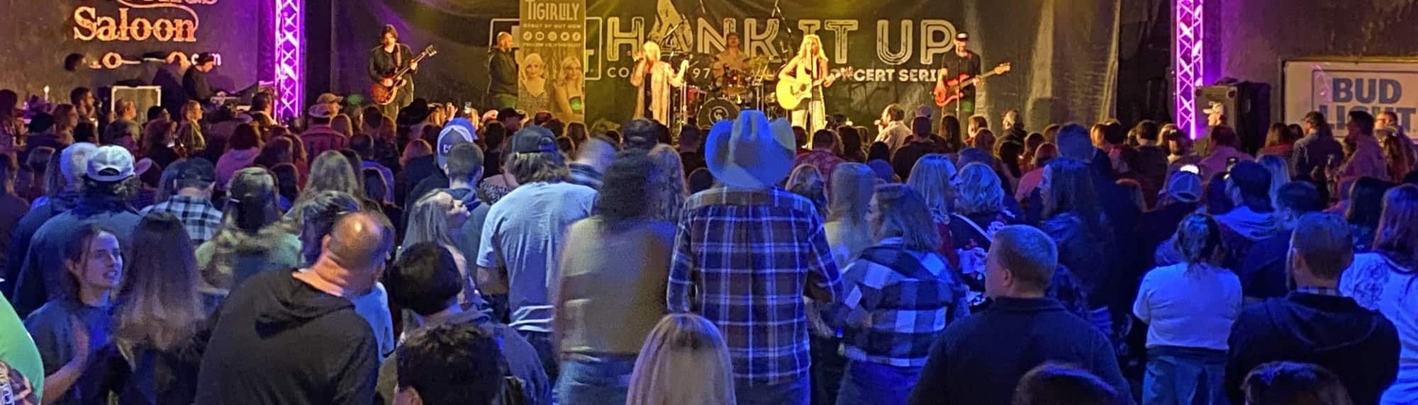 country concert with fans wearing cowboy hats State College